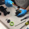 Repair Technician Repairing Spray Gun Apllictor